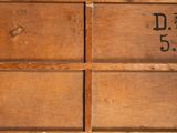 a wooden box that has a number on it