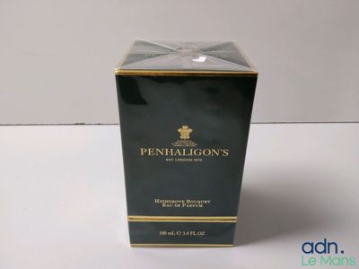 a close up of a box of perfume on a table