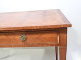 a small wooden table with a drawer on top of it