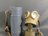 a gas mask and a bucket on the table