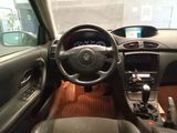a steering wheel and dashboard of a car in a car showroom