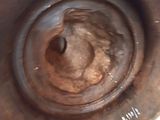 a close up of a rusted metal object on a table