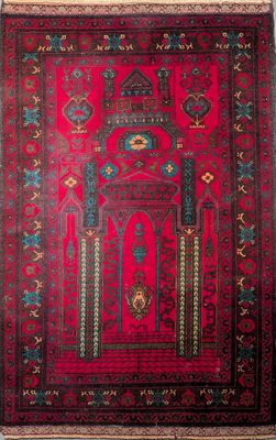 a red rug with a design on it