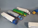 several toy trucks are lined up next to each other on a table