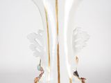 a glass vase that has a gold stripe on it