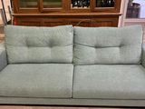 a couch that is sitting in the middle of a room