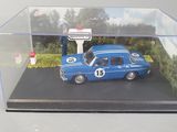 a miniature model of a blue car in a display case