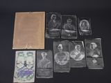an old photo of a bunch of old photos on a table