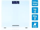 a white bathroom scale with a clock on top of it