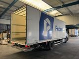 a delivery truck that is parked in a warehouse