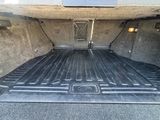 a truck bed with a flat bed in the back of it