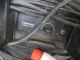 a close up of a motor bike with wires and a hose