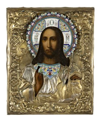 une icône dans un cadre doré représentant Jésus tenant une croix entre ses mains