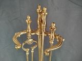 a gold statue of a man and a woman holding a sword