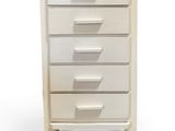 a white chest of drawers with five drawers on each side
