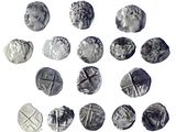some silver coins are arranged in a circle on a white surface