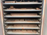many trays of wood in a metal rack