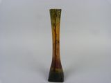 a vase that is sitting on a white surface