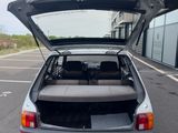 a car with its trunk open in a parking lot
