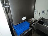 an image of a kitchen with a blue blanket on the counter