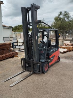 a forklift that is sitting in the middle of a lot