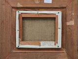 a close up of a picture frame with a label on it