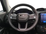 the interior of a car with a steering wheel, dashboard, and touch screen