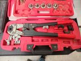 a red case with tools in it on a table