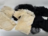 three pairs of black, white, and beige lingersuits on a white surface
