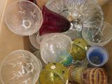 a box full of empty wine glasses and wine bottles