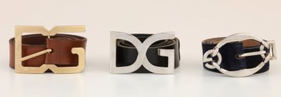 three different belts are lined up on a white surface