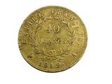 a close up of a gold coin on a white background