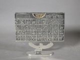 an image of a silver plate with a calendar on it