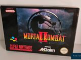the box for the nintendo game mortal komba 2 is shown