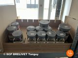 a box full of buckets of food sitting on a shelf