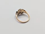 a close up of a gold ring with a diamond on it