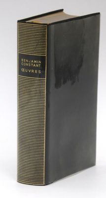 a close up of a book on a white surface