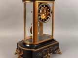 a black and gold clock sitting on a table
