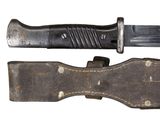 a knife that is laying on top of a piece of leather