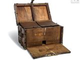 an old wooden chest with two open doors