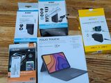 several boxes of various electronic devices on a wooden surface