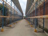 an image of a long walkway with scaffolding on the sides