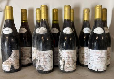 six bottles of wine are lined up in a row on a counter