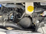 a picture of a car engine with its hood open