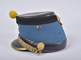 a blue hat with a gold chain around it