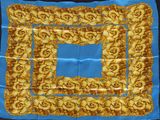 yellow and blue square scarf with golden flowers on a blue background
