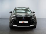 the front view of a black car in a white room