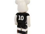 a black and white lego bear with a number 10 on it