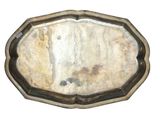 a silver tray with a mirror on it on a white surface