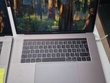 two laptops that are sitting on a table